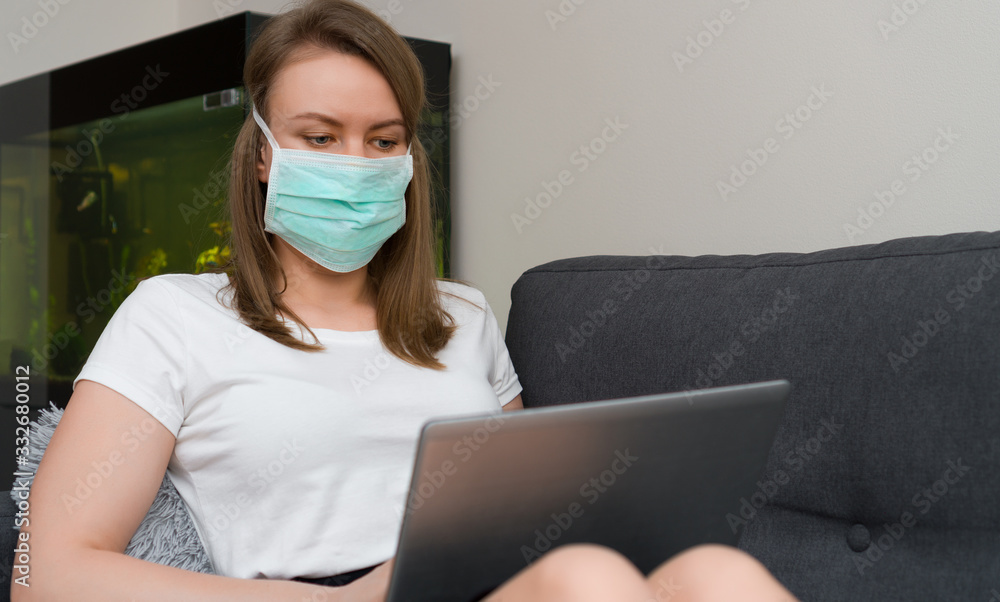Woman in medical mask working from home. Isolation at home. Woman in medical mask working from home. Isolation at home.