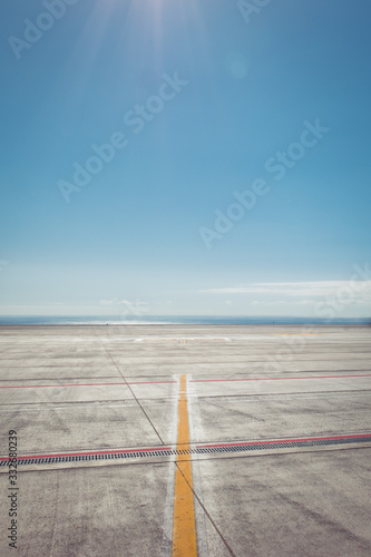 Tenerife South airport runway by the ocean photo