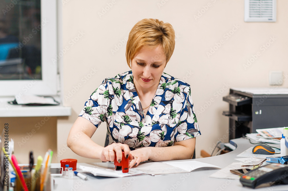 Veterinarian fills out documentation at the desk Veterinarian fills out documentation at the desk