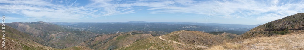 Fototapeta premium Cloudy day panoramic landscape from top of hill