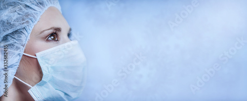 Fotografia Corona virus - Ilustration picture, nurse wearing a mask,
