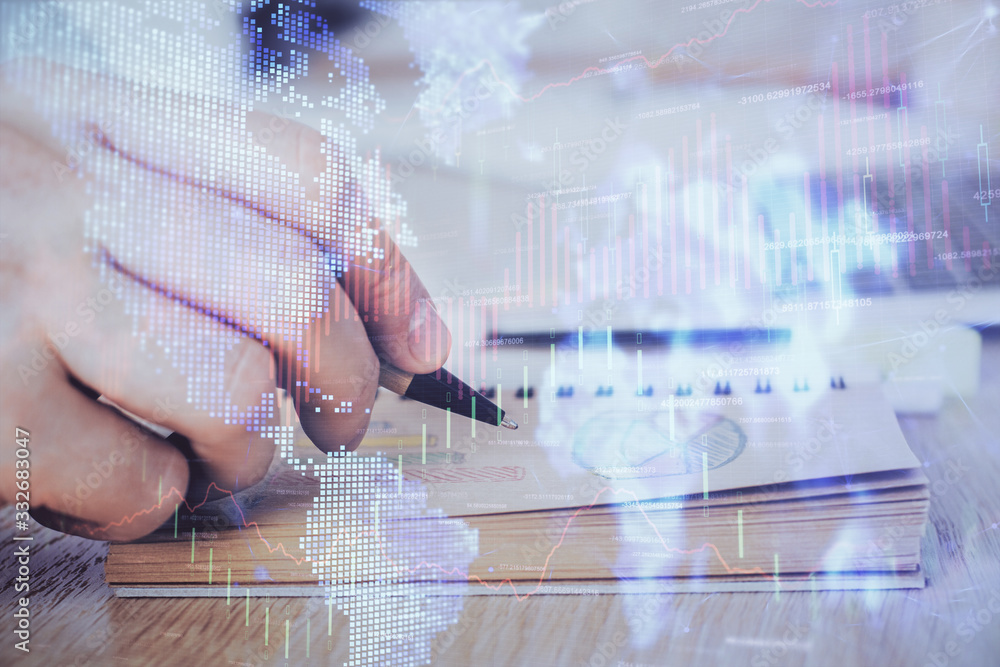 Multi exposure closeup hands with stock market forex graph.