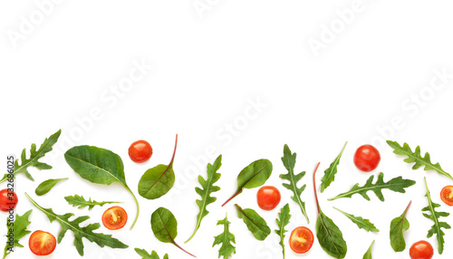 Vegetable frame with place for text  cherry tomatoes  lettuce  arugula  chard  mizuna  top view  flat lay. Vegetables isolated on a white background.