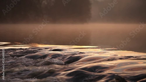 river in autumn in the morning with mist over the water