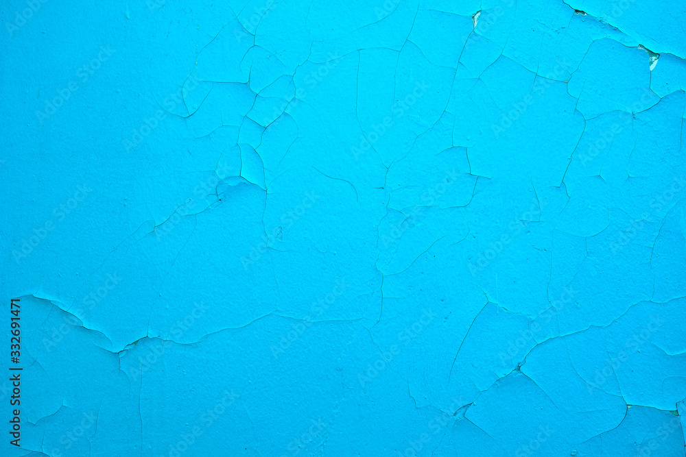 Cracked paint on the wall. Blue. Textura, destruction, paint flaking.
