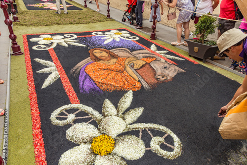 la Orotava, Tenerife, Spain - June 27, 2019. Beautiful flower carpets in La Orotava during Corpus Christi. Famous religious event and competition of folk art. Warm summer evening and joyful visitors