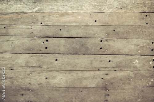 Closeup of old brown wooden plank texture background. Wallpaper backdrop. Abstract wood floor and wall structure. Top view angle. Horizontal pattern