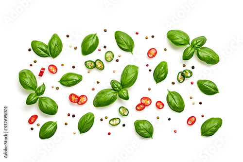 Basil, spices, chili pepper. Vegan diet food, creative green basil composition isolated on white. Fresh basil pattern layout, cooking concept, top view.