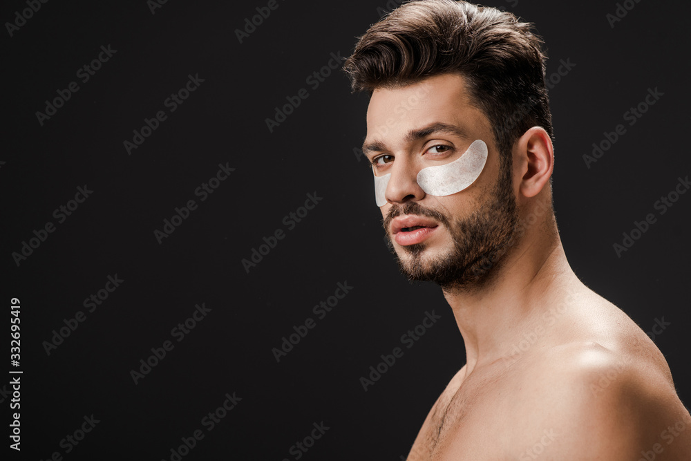 handsome sexy nude man with eye patches on face isolated on black handsome sexy nude man with eye patches on face isolated on black