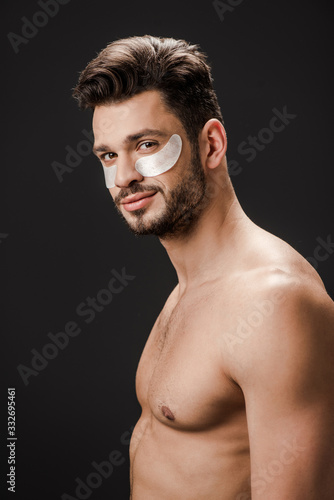 sexy nude man with eye patches on face isolated on grey