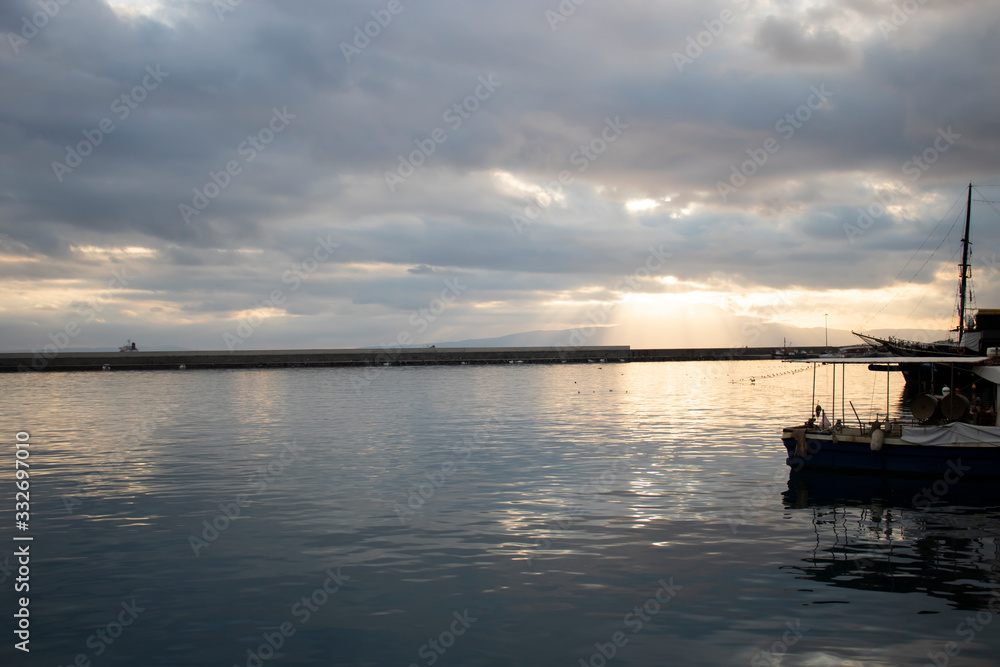 Dock on a cloudy day druing sunset Dock on a cloudy day druing sunset