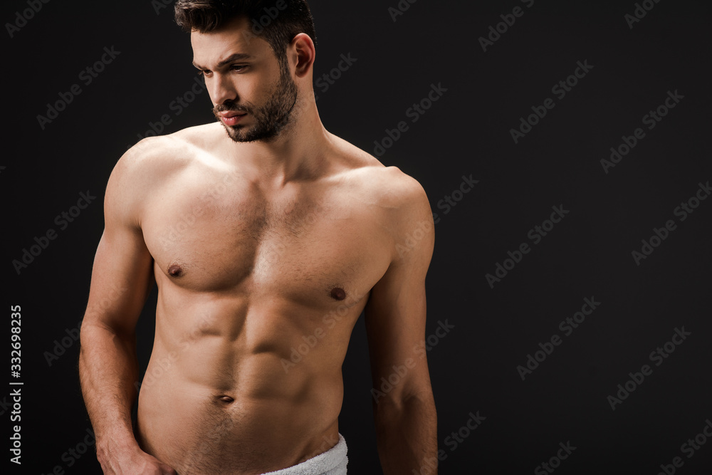 handsome sexy man in towel isolated on black handsome sexy man in towel isolated on black