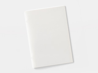 Blank magazine or brochure isolated on white. Front cover top view as mockup template for your design presentation