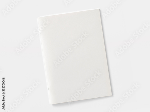 Blank magazine or brochure isolated on white. Front cover top view as mockup template for your design presentation