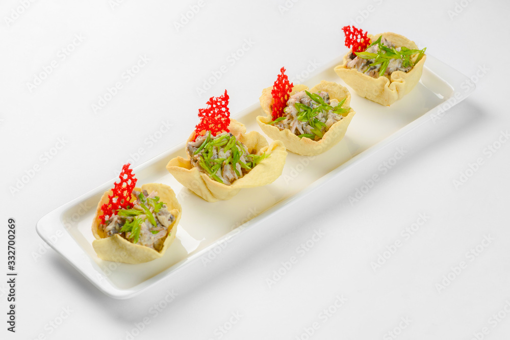 Snack baskets on a glass plate. Catering service Snack baskets on a glass plate. Catering service