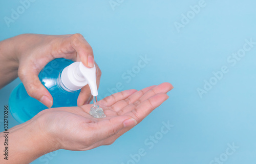 Close up woman hand take cleaner from alcohol sanitizer bottle. Protective coronavirus or covid-19 outbreak concept.