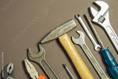 Wallpaper Mural Construction tools on textured grunge paper consisting of pipe wrench, screwdriver, metal, hammer and free copy space on the top Torontodigital.ca