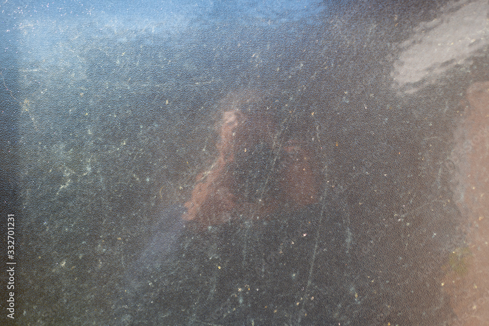 plain glass background illuminated by sunlight and with a slight reflection