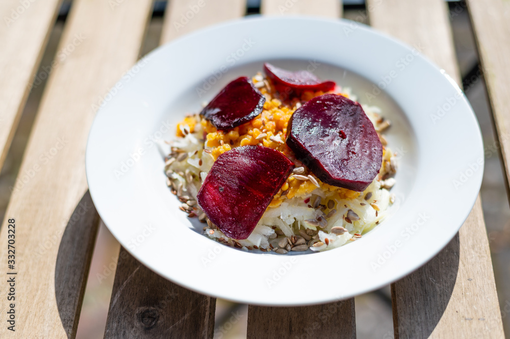 delicious salad on a white plate with kohlrabi, beetroot, lentils and grains delicious salad on a white plate with kohlrabi, beetroot, lentils and grains