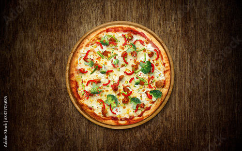 Food ingredients and spices for cooking mushrooms, tomatoes, cheese, onion, oil, pepper, salt, basil, olive and delicious italian pizza on black concrete , wood background. Copyspace. Top view. Banner