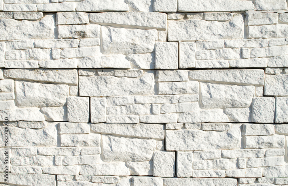 Fototapeta premium Wall cladding imitating white stone