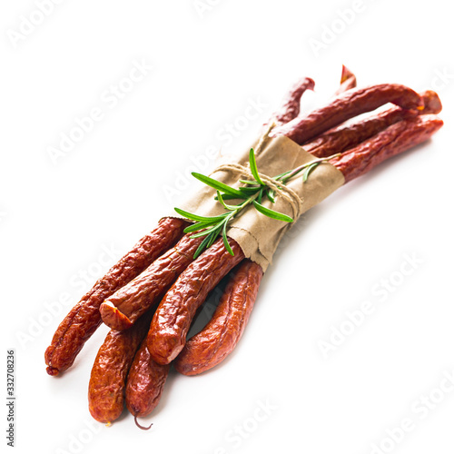 Kabanos or Cabanossi Thin Dry Smoked Polish Sausage Isolated on White background. Selective focus. photo