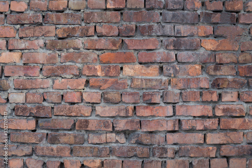 The texture of the brickwork of red brick. External part of the building.