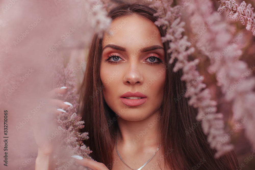 Beautiful girl in flowering branches Beautiful girl in flowering branches