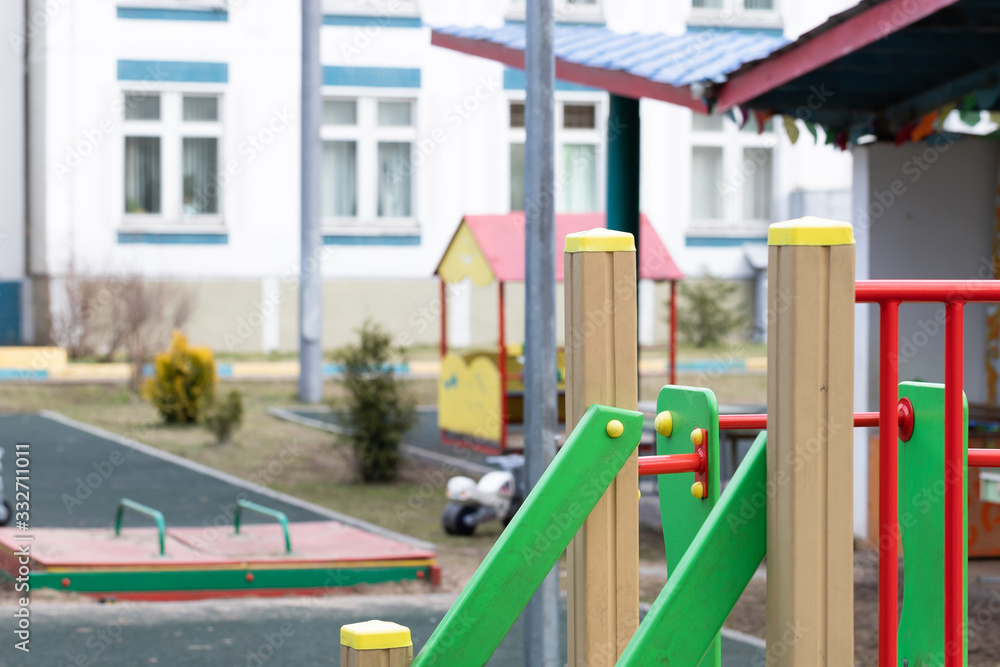 An empty Playground in a kindergarten on a Sunny spring day. An empty Playground in a kindergarten on a Sunny spring day.