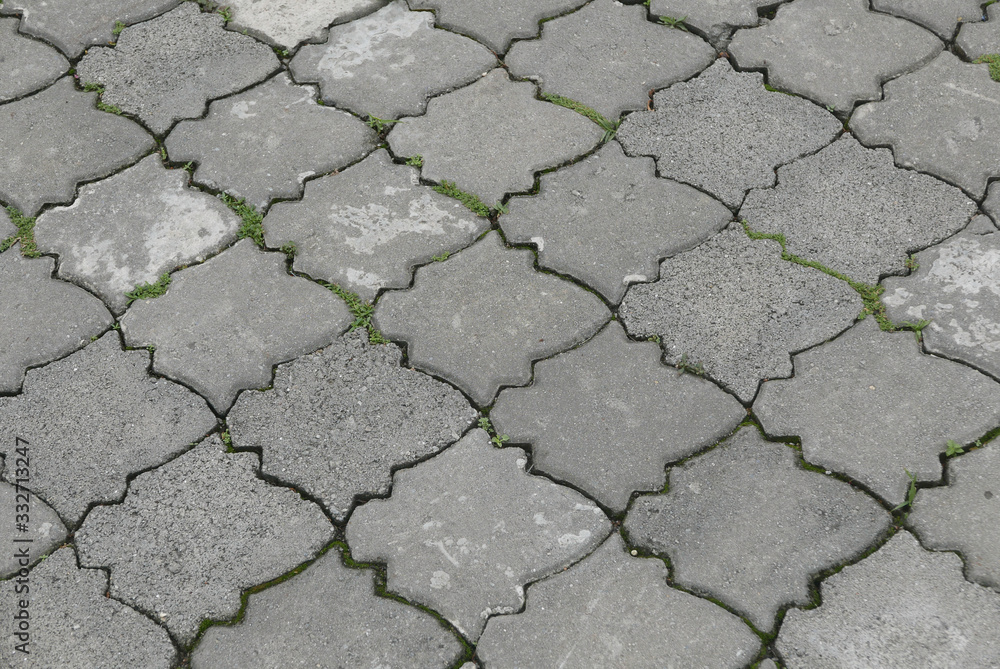 Obraz premium Gray interlocking paving stone driveway directly from above.