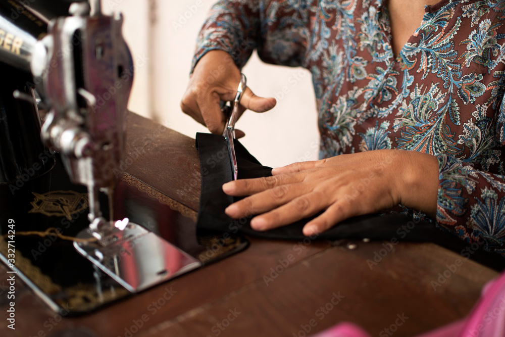 Working hands of a tailor
