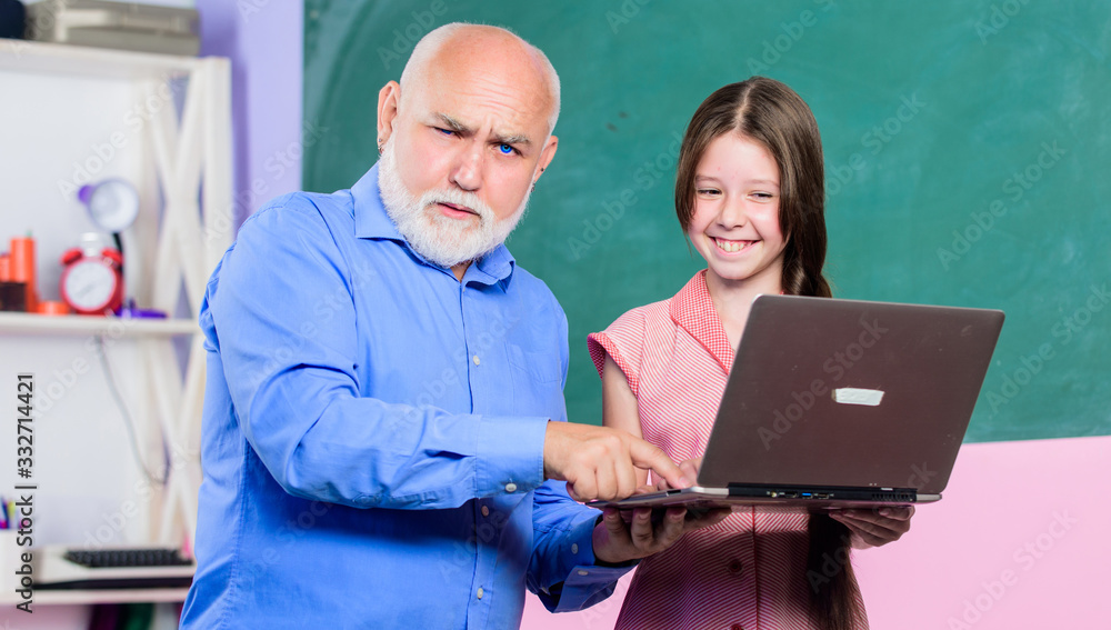 Everyone a learner everyday. teacher help school girl. online education. Back to school. school shopping online. cyber monday. small girl with man tutor study on laptop. modern technology in learning Everyone a learner everyday. teacher help school girl. online education. Back to school. school shopping online. cyber monday. small girl with man tutor study on laptop. modern technology in learning