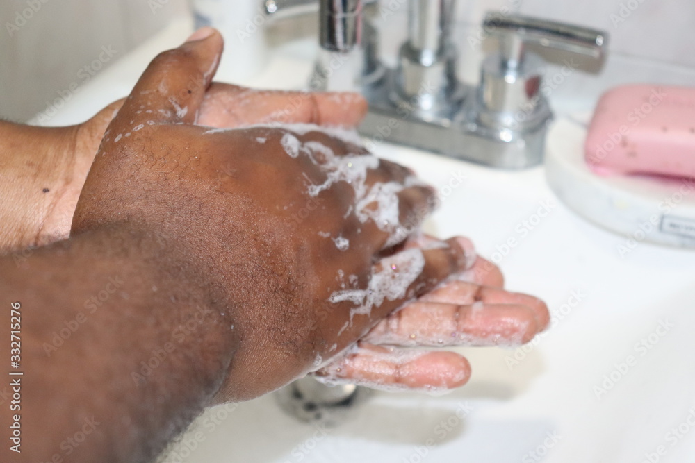 Fototapeta premium Man washing hands with soap