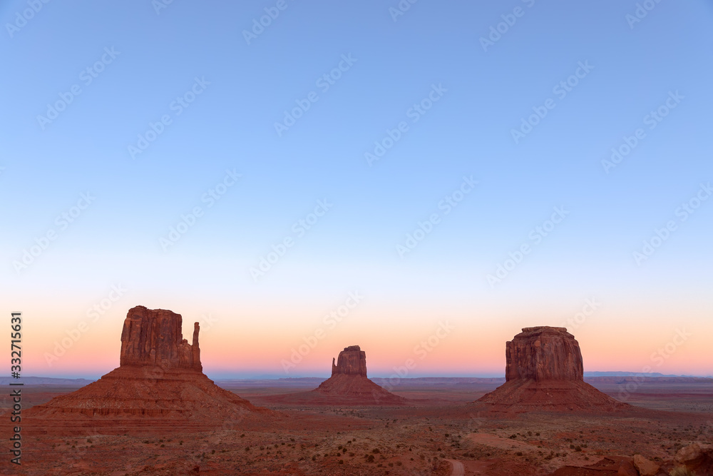 Beautiful sunset over famous Buttes of Monument Valley on the border between Arizona and Utah, USA Beautiful sunset over famous Buttes of Monument Valley on the border between Arizona and Utah, USA