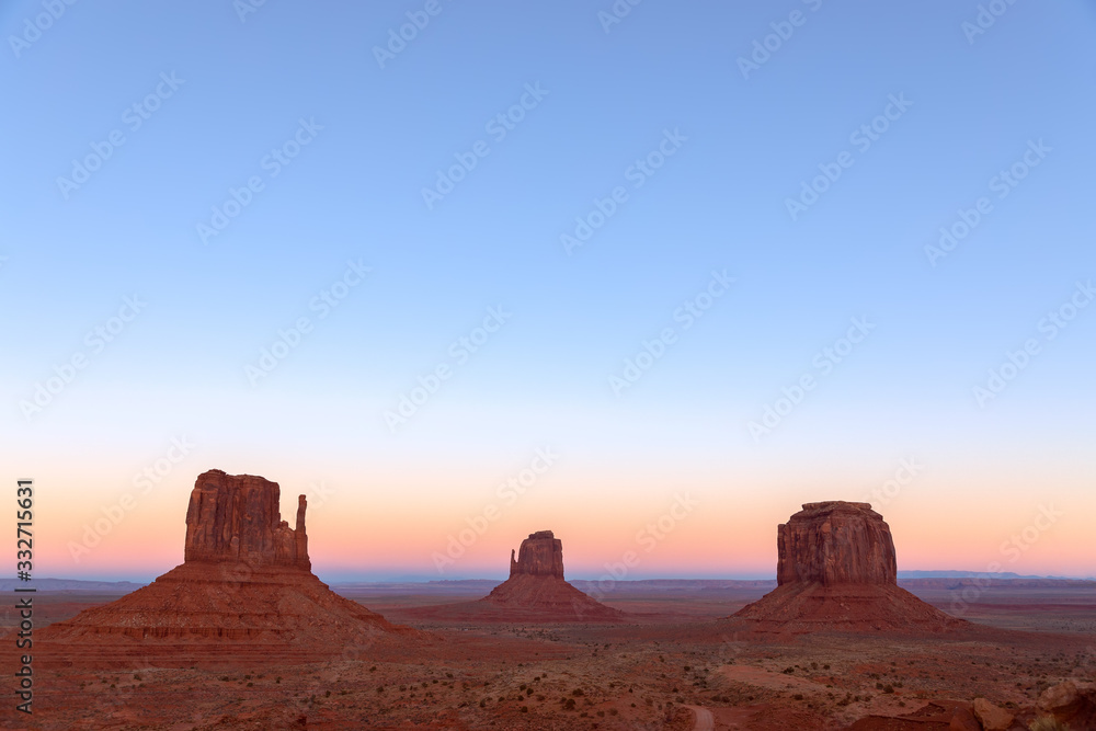 Beautiful sunset over famous Buttes of Monument Valley on the border between Arizona and Utah, USA