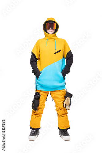 Portrait young man in sportswear in yellow long sweater isolated white background holds glasses. Concept skier, snowboarder