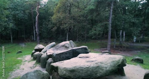 The Dolmen (Hunebedden) of Drenthe: Dolmen D45 located in a Forest in Emmen, Approach Shot, Drenthe, The Netherlands / Holland 4K Drone Footage