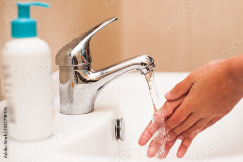 health care washing hands in the sink