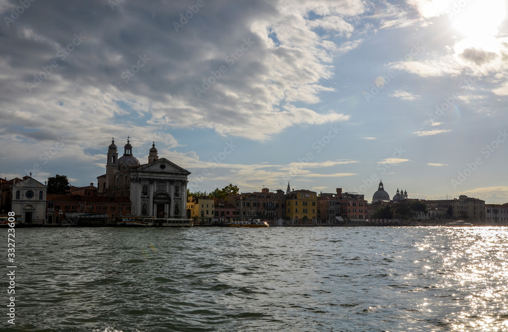 Tourist boats opposite the Church of Santa Maria del Rosario (Gesuati). View from Giudecca Canal. Boat trip, Venice, Italy 