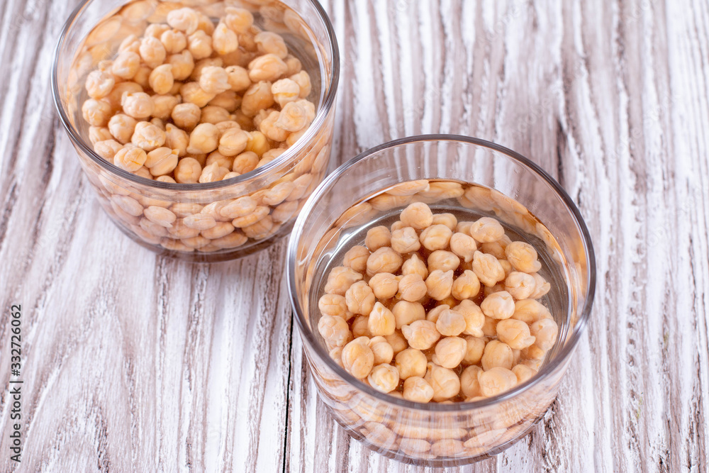 Chickpea, dry chickpeas beans in water in bowl Chickpea, dry chickpeas beans in water in bowl