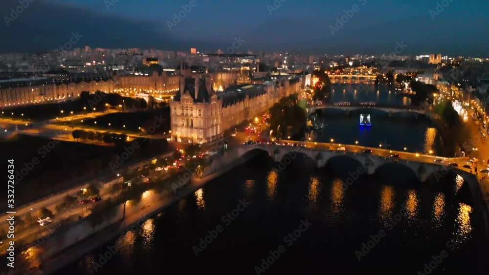 Establishing aerial view of Paris Tour Eiffel Tower, Paris Louvre Museum, Seine River and Tuileries Garden park at night Establishing aerial view of Paris Tour Eiffel Tower, Paris Louvre Museum, Seine River and Tuileries Garden park at night
