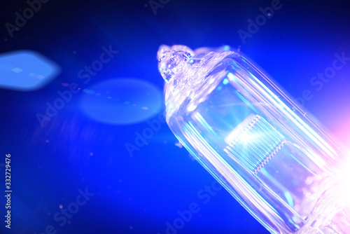 blue electric light bulb with smoke photographed in the studio