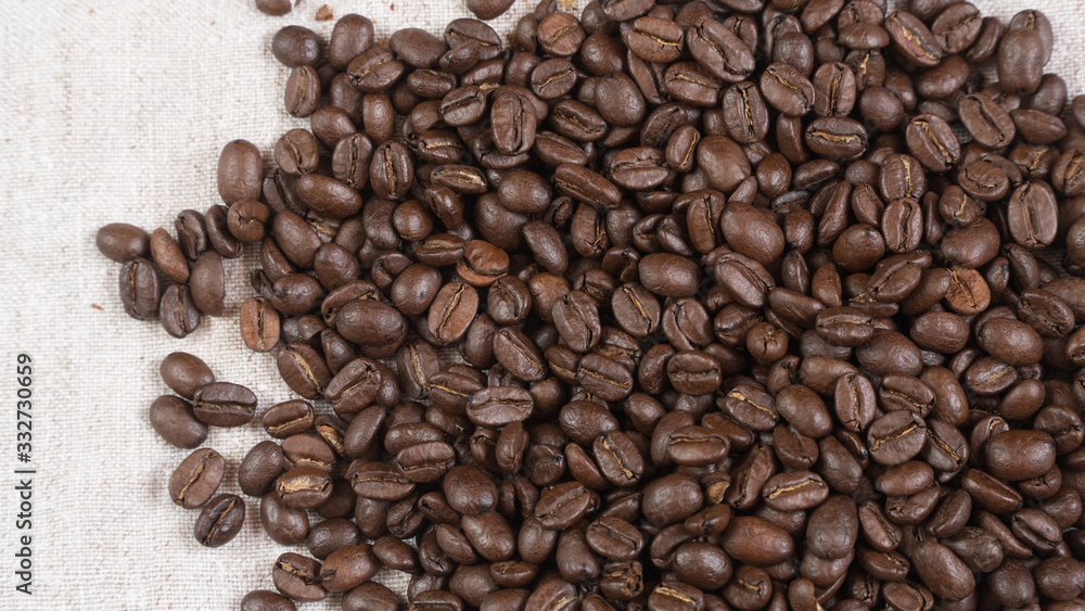 coffee beans.coffee beans sprinkled on fabric. coffee beans.coffee beans sprinkled on fabric.