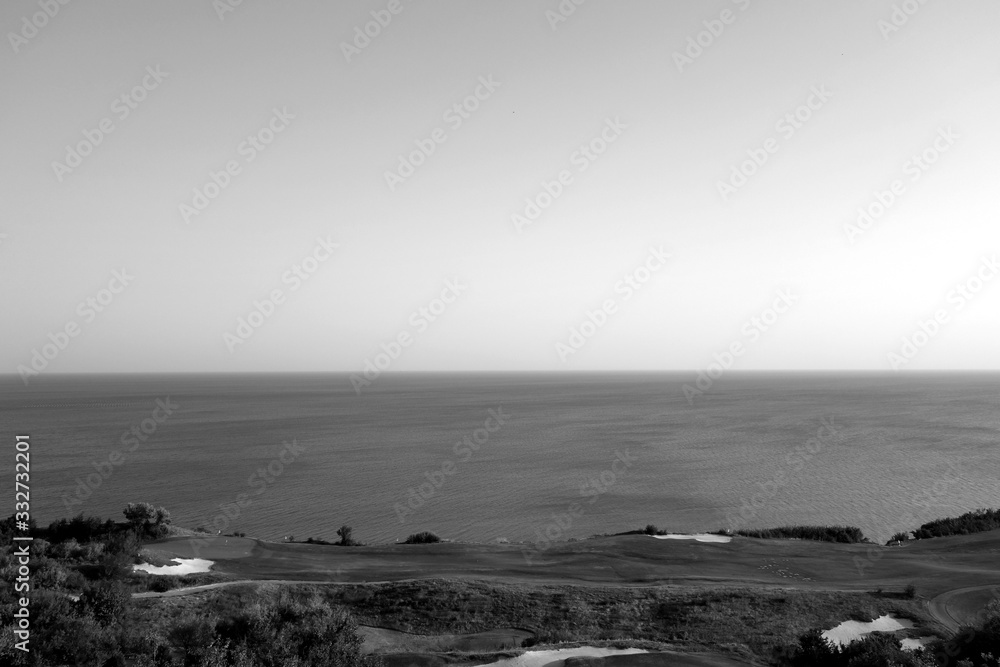 Golf fields and Black sea resort in black and white.