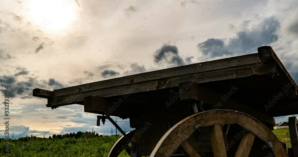 Antique wooden cart standing alone in a field, beautiful autumn landscape, hyperlapse, time lapse, heavy autumn sky Antique wooden cart standing alone in a field, beautiful autumn landscape, hyperlapse, time lapse, heavy autumn sky