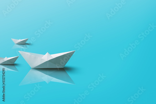 Paper Boats on Blue Background. Origami Boat Background.