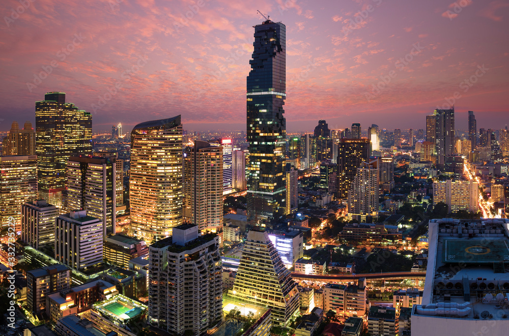 Naklejka premium Aerial view of Bangkok modern office buildings, condominium in Bangkok city downtown with sunset sky , Bangkok , Thailand