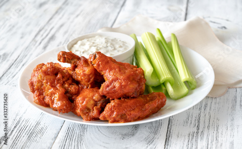 Bowl of buffalo wings with blue cheese dip