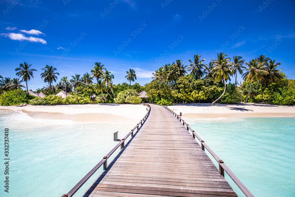 Amazing tropical landscape, beach scenery, long jetty into paradise island. Summer beach view, palm trees on white sandy beach. Tranquil tropical nature