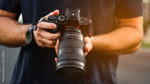 Photographer Holding DSLR Camera